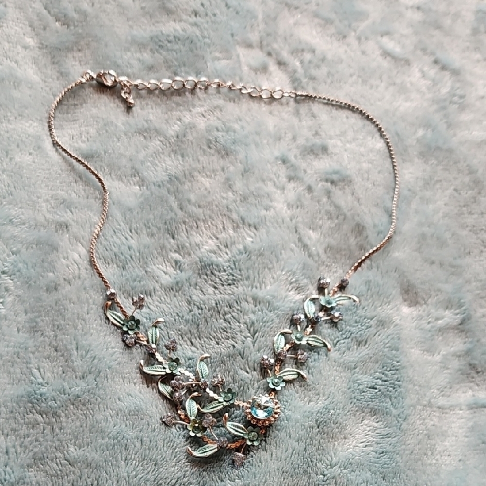 Silver and Green Floral Necklace with Gemstone Accents